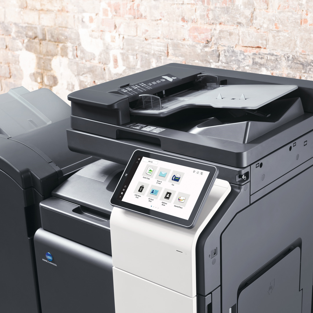 Multifunction photocopier with a touchscreen control panel in a modern office